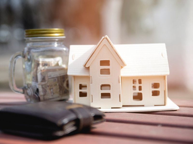 miniature-house-with-savings-jar-wallet-scaled.jpg